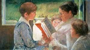 family together with mother reading a book