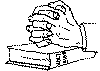  mans hands whilst praying upon a Bible