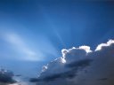 sunbeams behind clouds