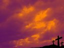Three crosses before a red sky