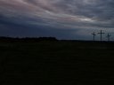  three crosses standing out to a dark sky