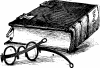 pair of glasses by a Bible